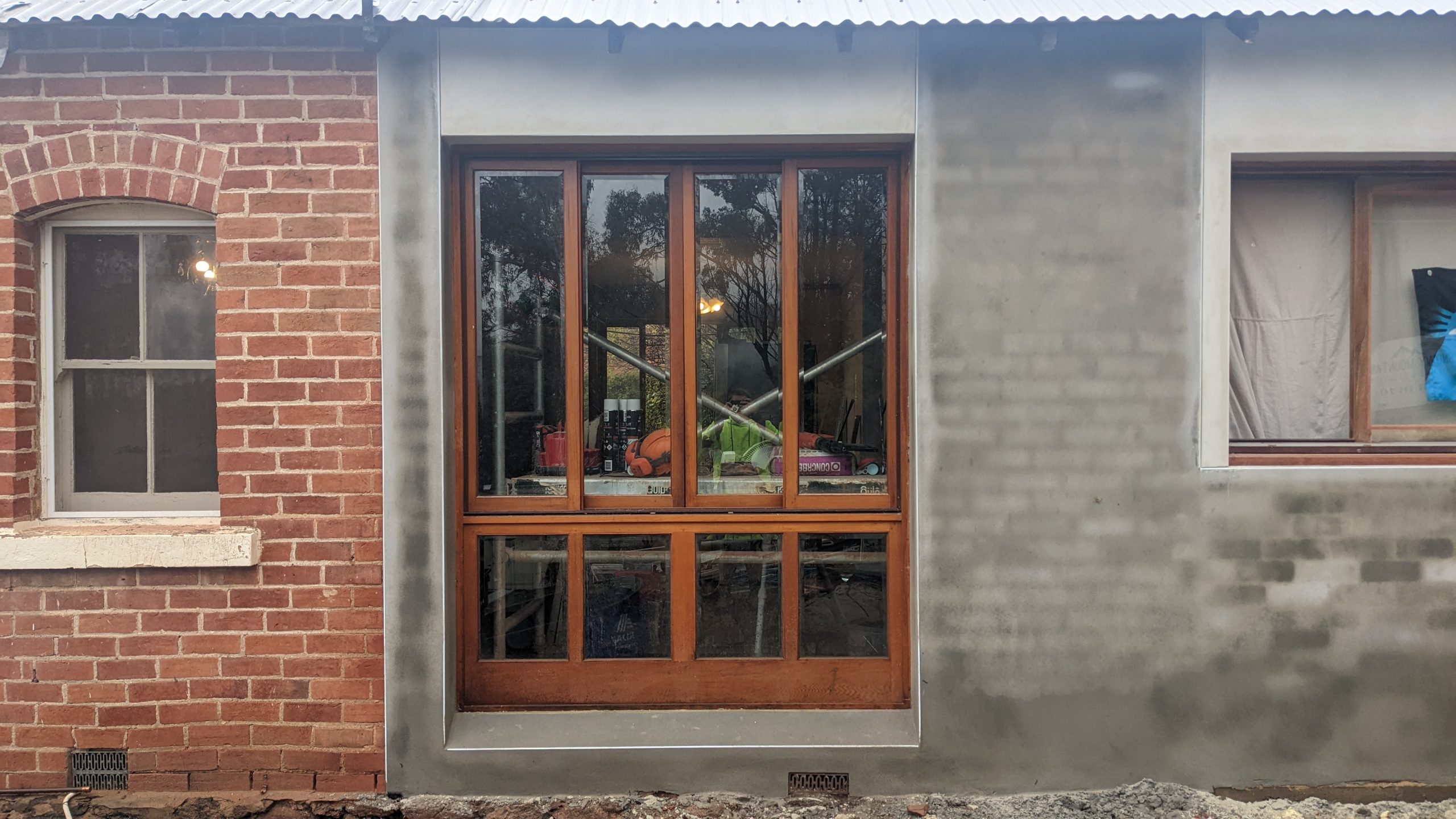 Custom timber window joinery in a brick wall, Canberra home