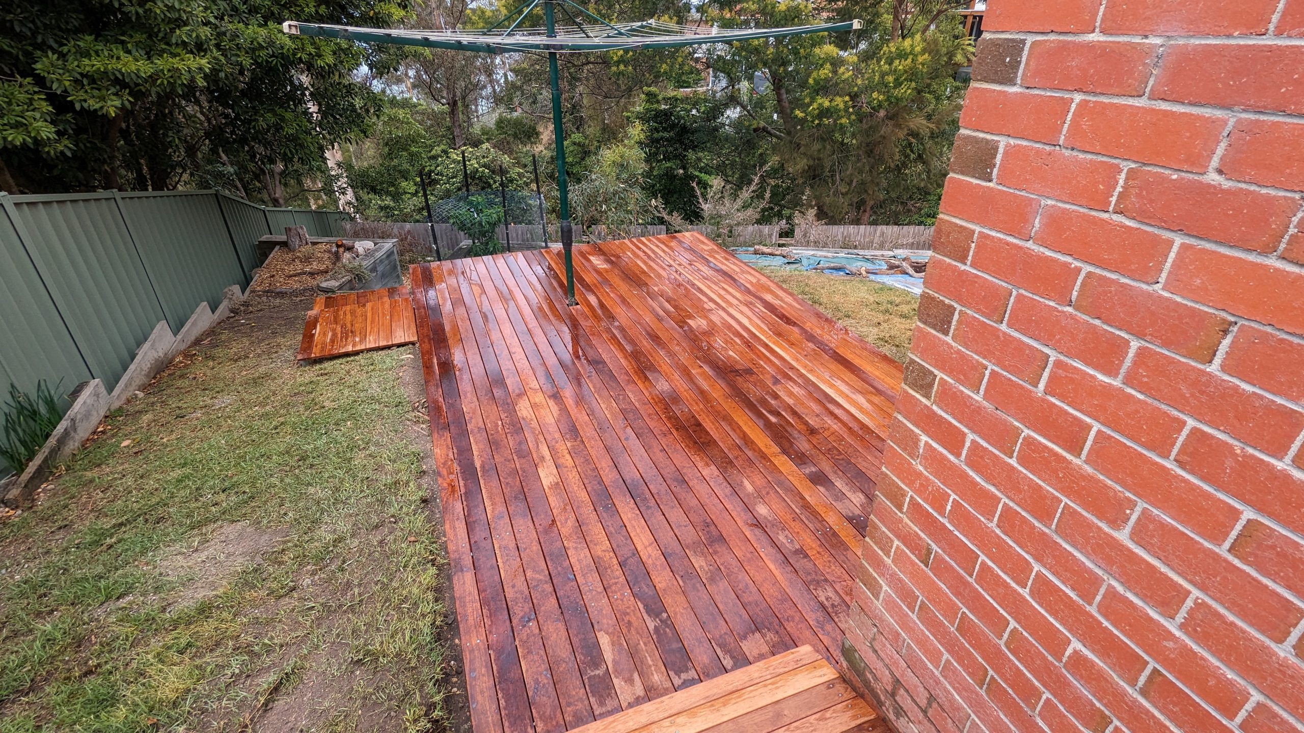 Newly built warm merbau timber deck in a Canberra backyard